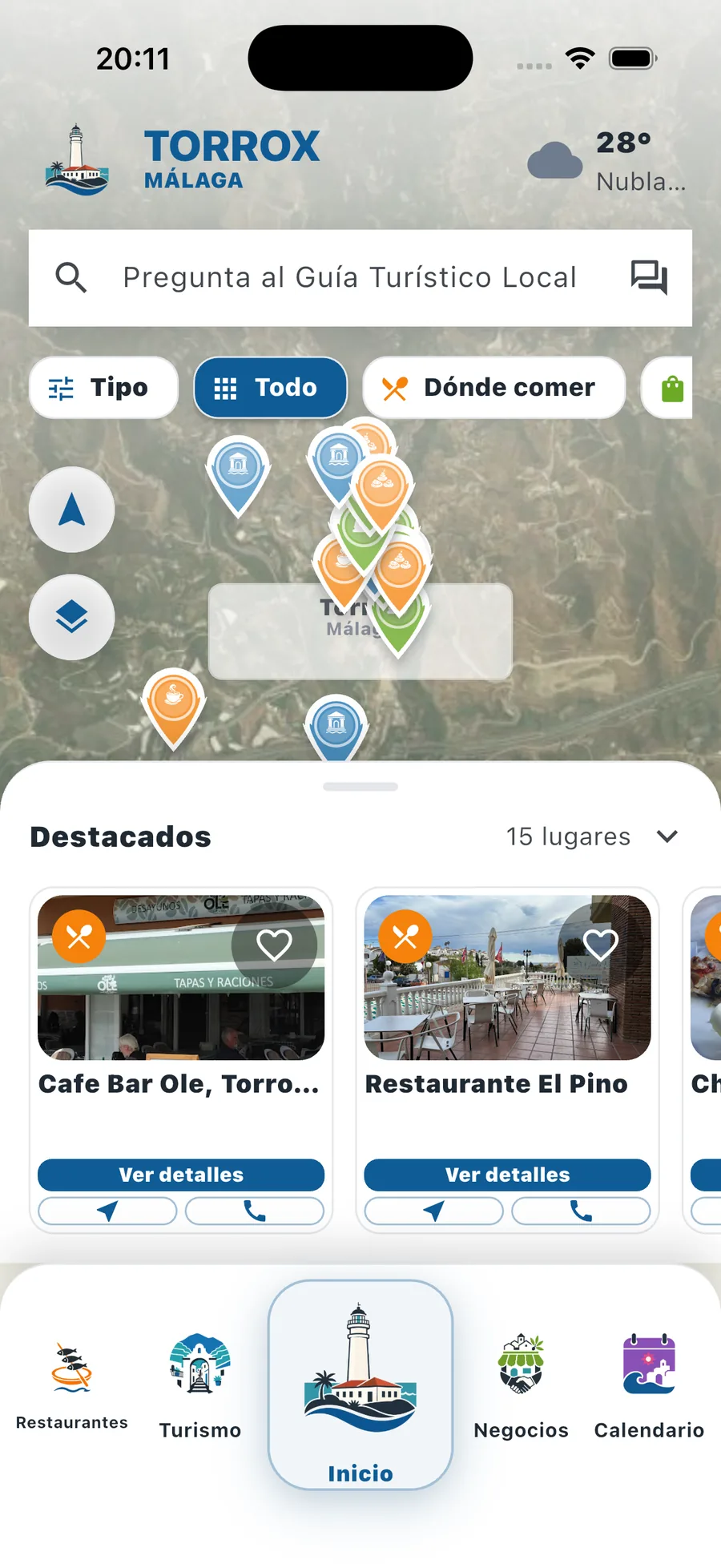Pantalla de inicio de TouristSolution en un iPhone, con la guía del municipio de Torrox.